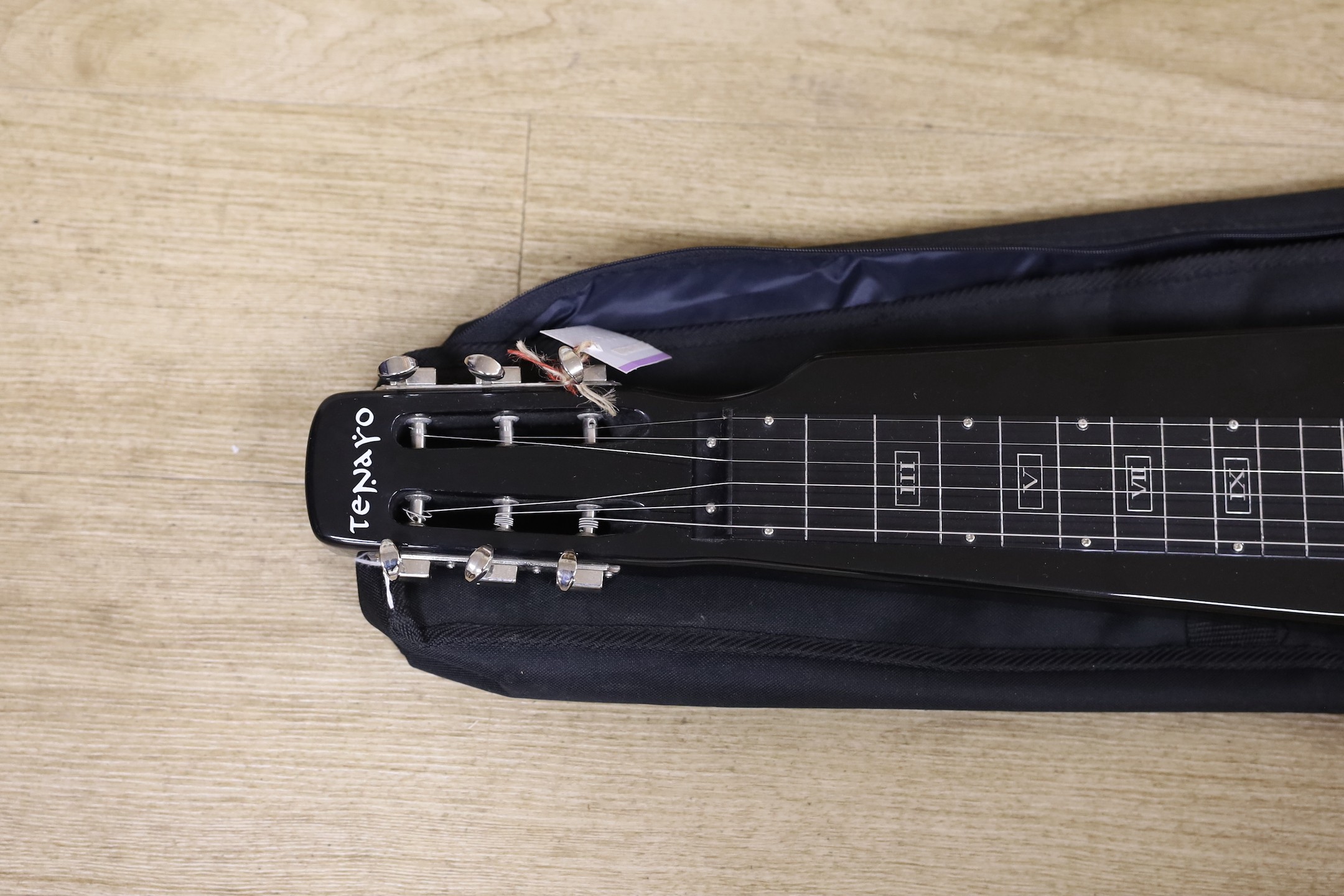 A Tenaro lap steel guitar, 74 cms long.